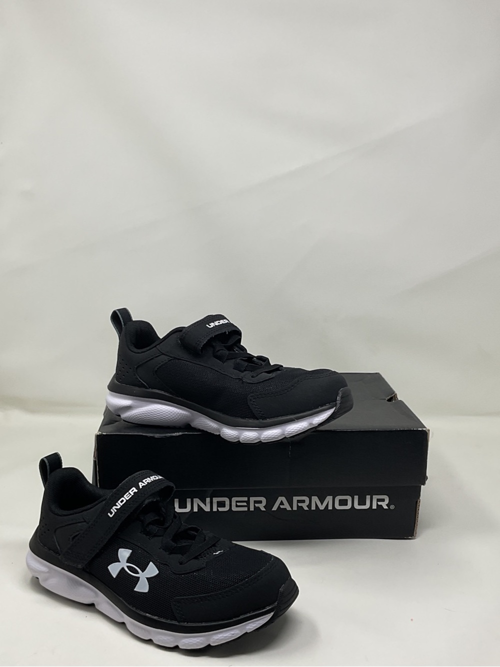 Under Armour Black and White Kids' velcro strap Athletic Sneakers shoes running